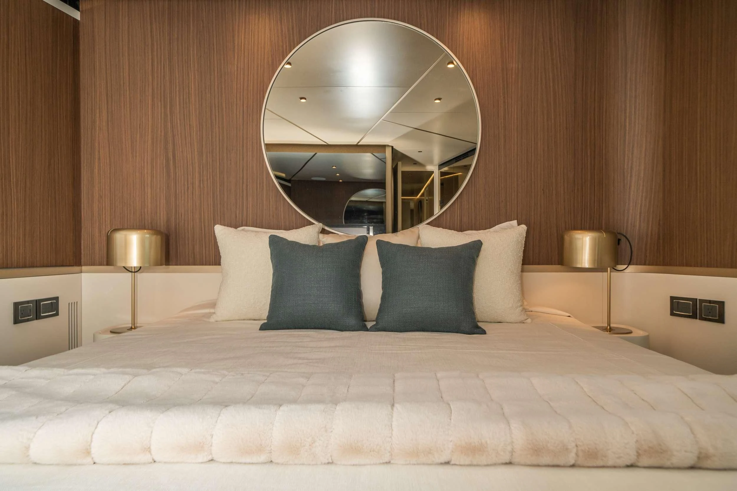 a bed with white sheets and pillows aboard GUBA TIMES Yacht for Charter