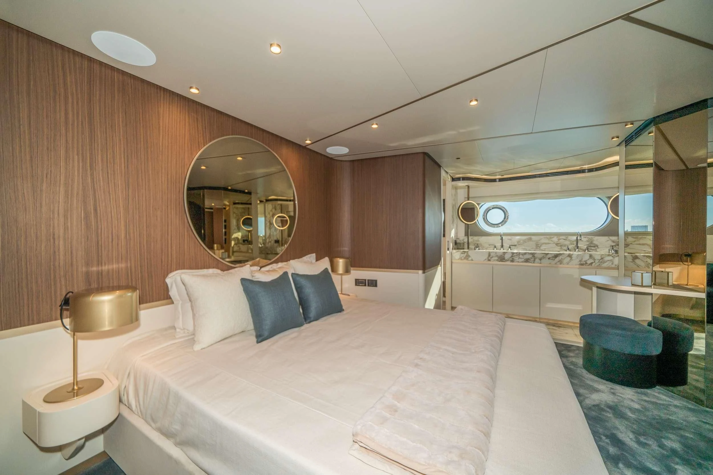 a large hotel room with a large bed and a large mirror aboard GUBA TIMES Yacht for Charter