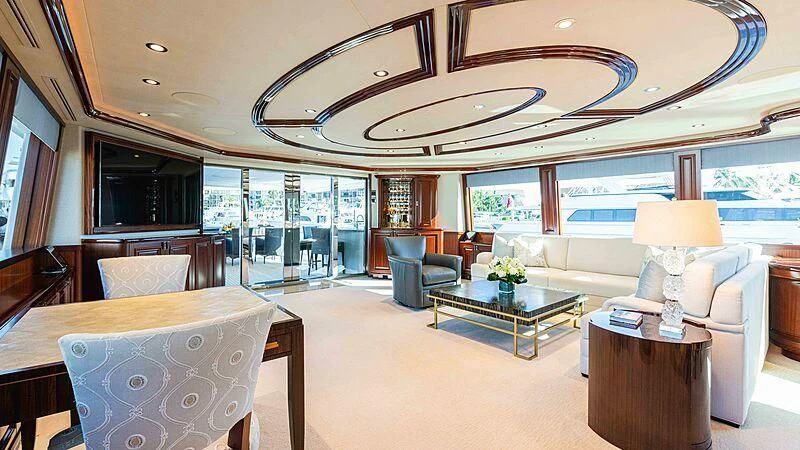 a large living room with a large glass ceiling aboard AMAZING GRACE Yacht for Sale