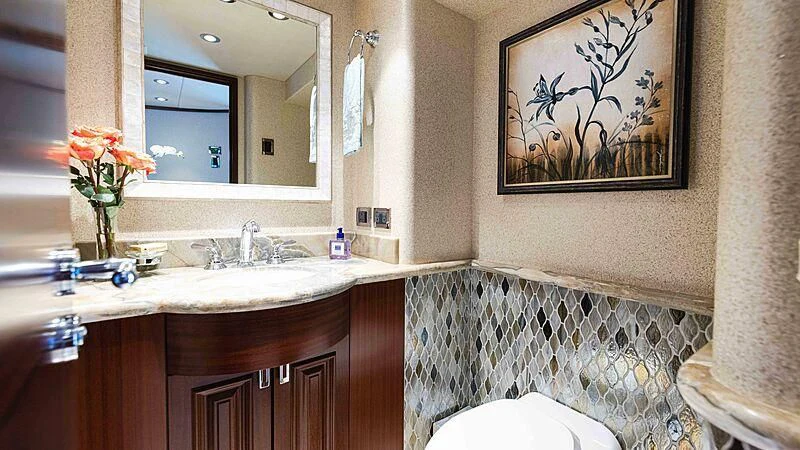 a bathroom with a sink and a mirror aboard AMAZING GRACE Yacht for Sale