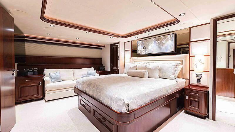 a large bedroom with a bed aboard AMAZING GRACE Yacht for Sale