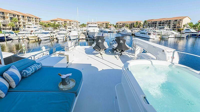 a pool with many boats aboard AMAZING GRACE Yacht for Sale