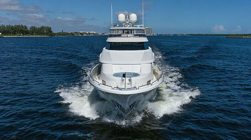 a white boat on water aboard AMAZING GRACE Yacht for Sale