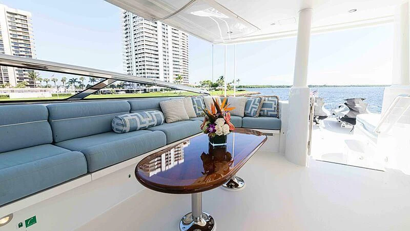 a living room with a couch and a table aboard AMAZING GRACE Yacht for Sale