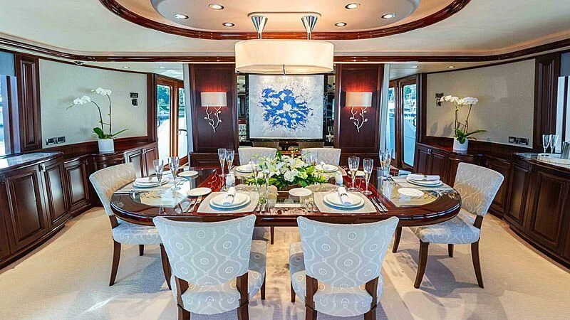 a dining room with a table and chairs aboard AMAZING GRACE Yacht for Sale