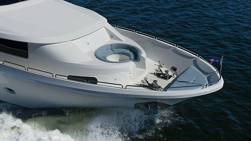 a white boat on the water aboard AMAZING GRACE Yacht for Sale