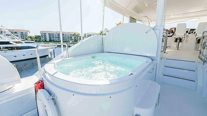 a large white boat in a large body of water aboard AMAZING GRACE Yacht for Sale