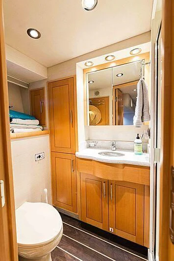 a bathroom with a mirror and a sink aboard AMAZING GRACE Yacht for Sale