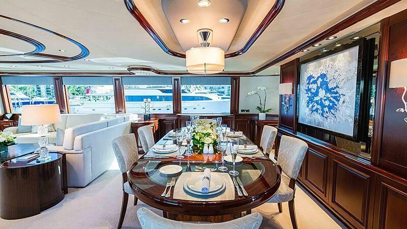 a dining room with a table and chairs aboard AMAZING GRACE Yacht for Sale