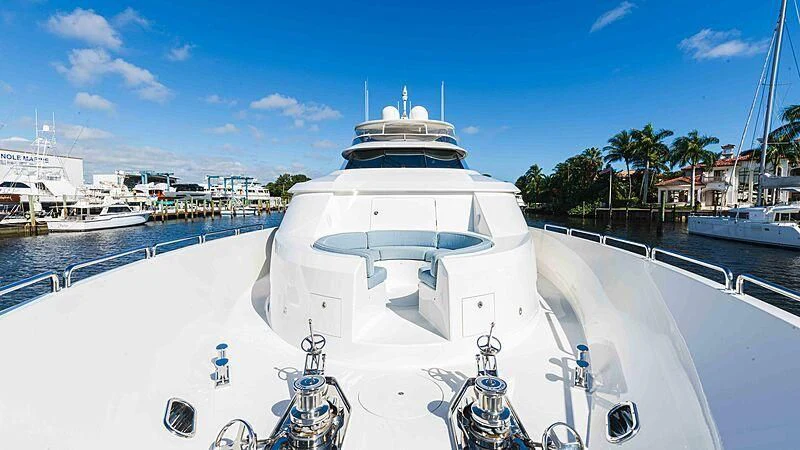 a white yacht in a harbor aboard AMAZING GRACE Yacht for Sale