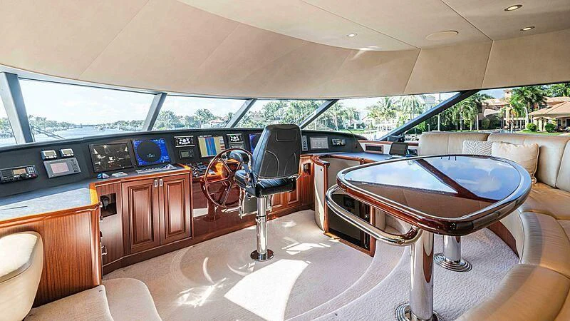 a table and chairs in a room aboard AMAZING GRACE Yacht for Sale