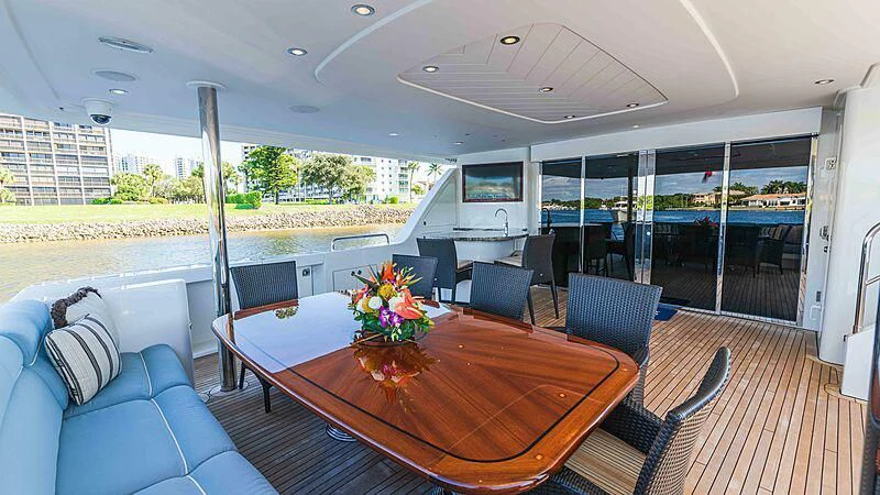 a large dining table in a room aboard AMAZING GRACE Yacht for Sale