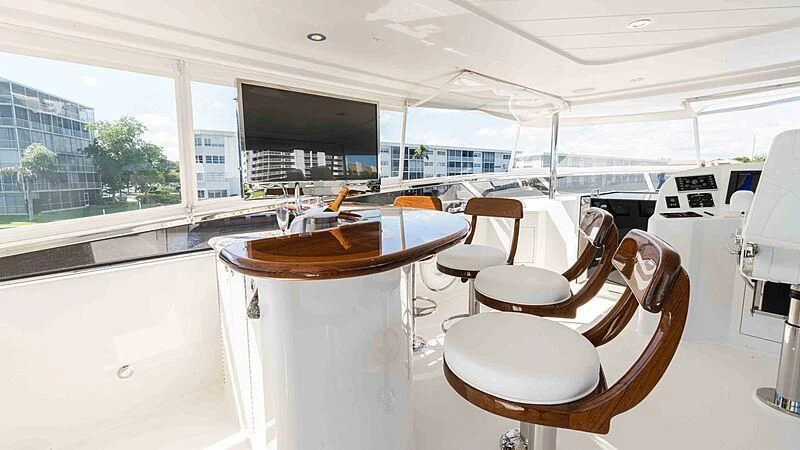 a room with a table and chairs aboard AMAZING GRACE Yacht for Sale
