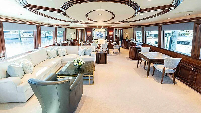 a large living room with a large chandelier aboard AMAZING GRACE Yacht for Sale