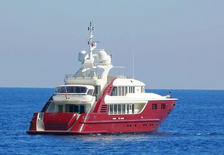 a red and white boat in the water aboard LEDRA Yacht for Sale