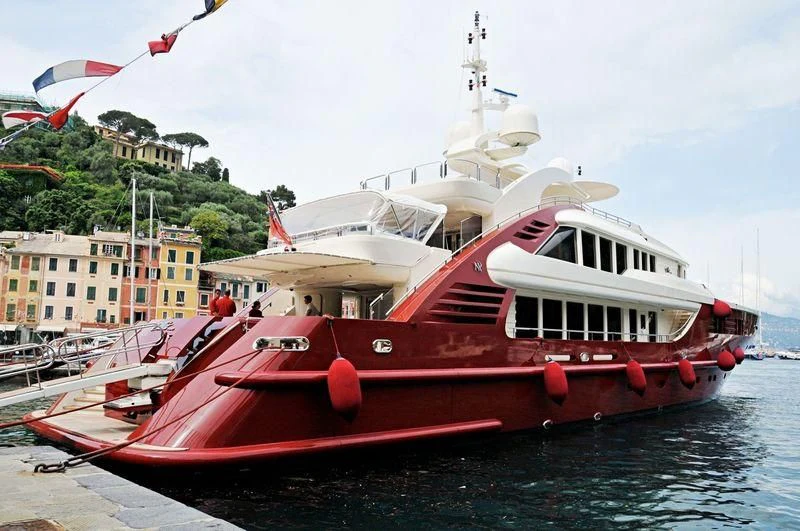a red and white boat docked aboard LEDRA Yacht for Sale