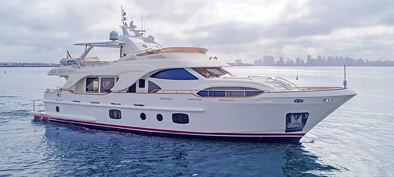 a white yacht in the water aboard XOXO Yacht for Sale