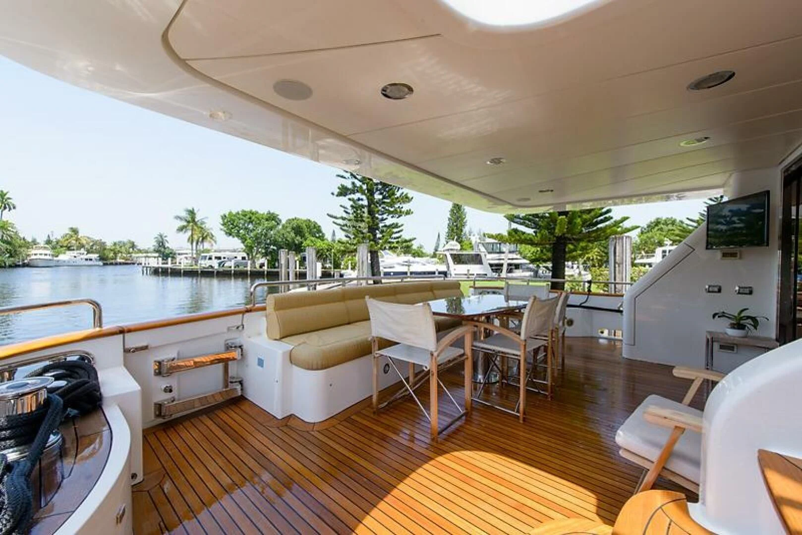 a large living room with a large pool and a deck aboard XOXO Yacht for Sale