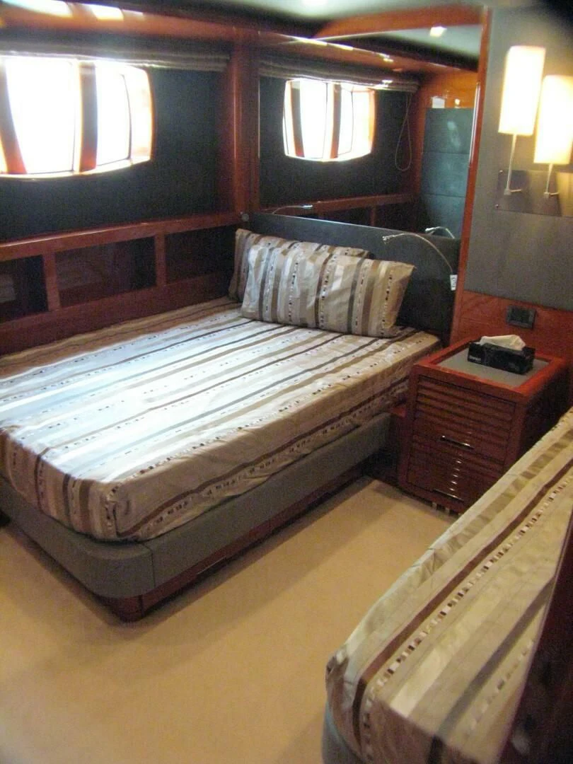 a bed in a cabin aboard XOXO Yacht for Sale