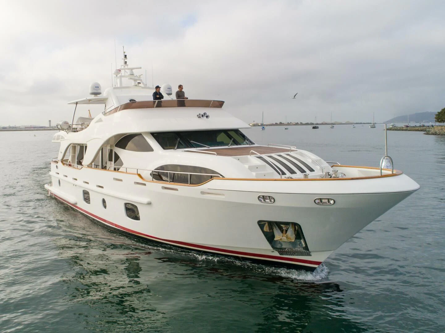 a white yacht on the water aboard XOXO Yacht for Sale