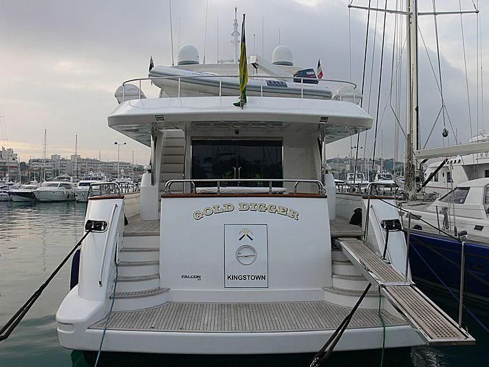 a white boat in a harbor aboard MONTE CARLO Yacht for Sale