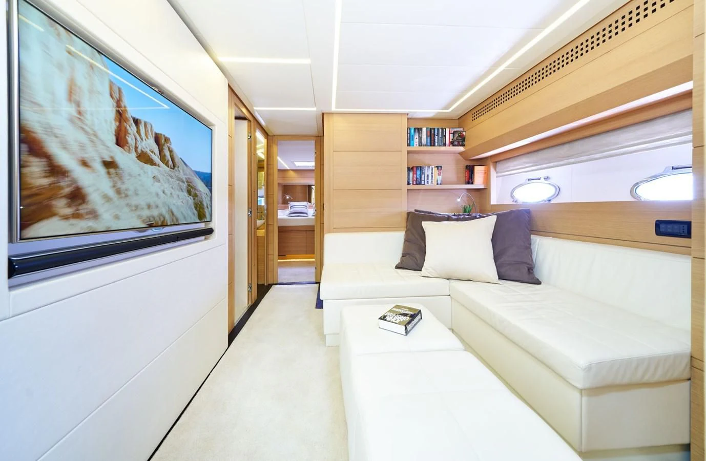 a room with a couch and a tv aboard HIT Yacht for Sale