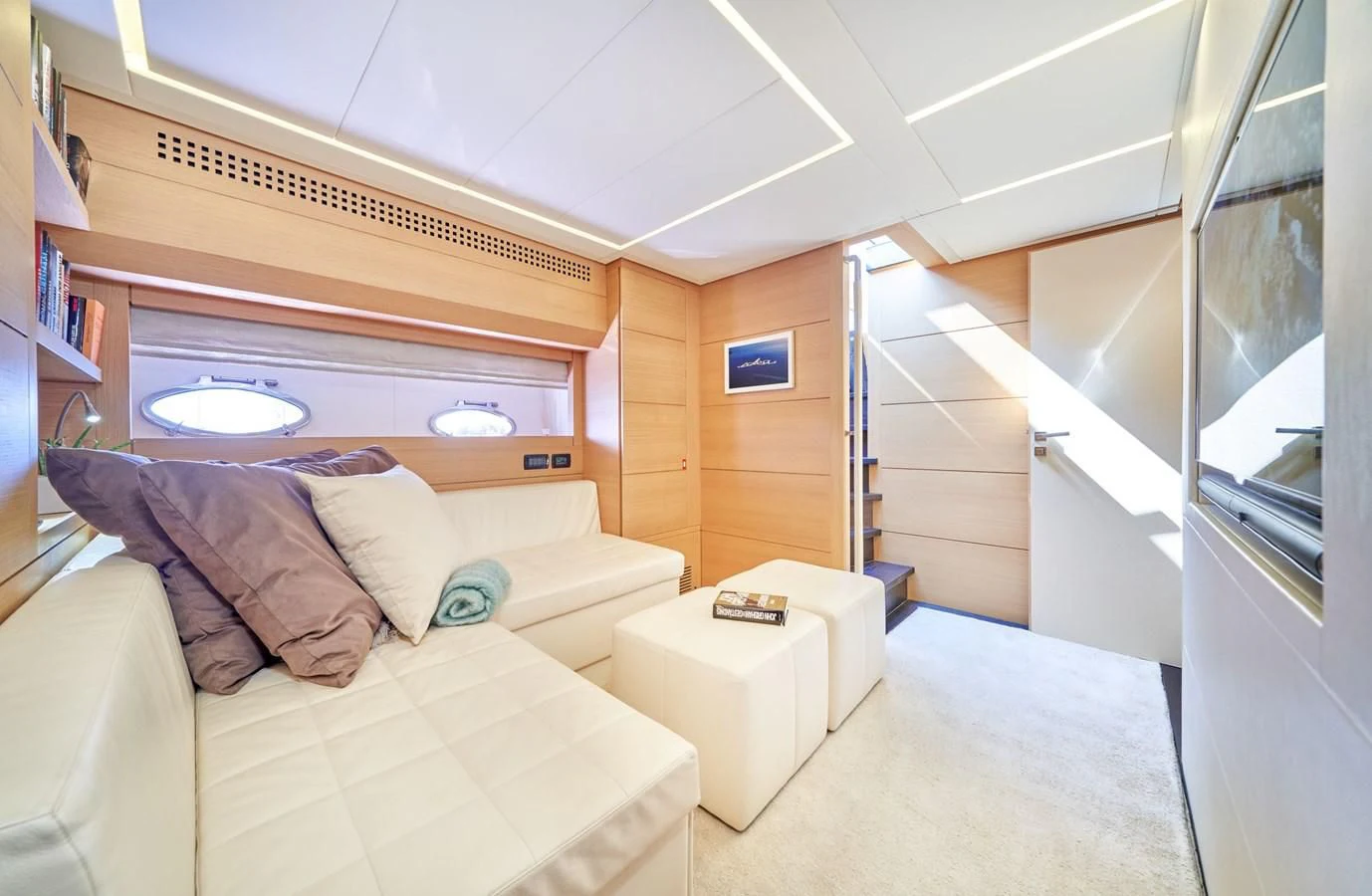 a room with a bed and a couch aboard HIT Yacht for Sale