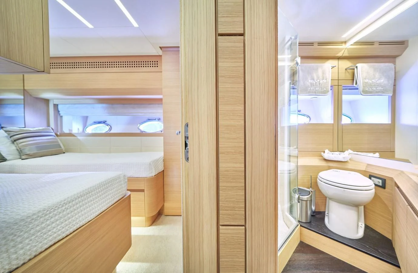 a bathroom with a glass door aboard HIT Yacht for Sale