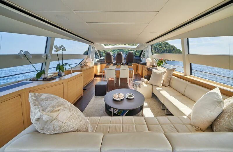 a living room with a large window aboard HIT Yacht for Sale