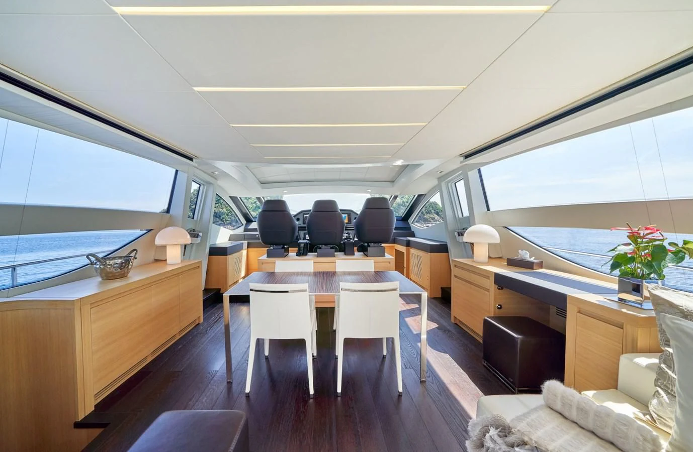 a room with a table and chairs aboard HIT Yacht for Sale