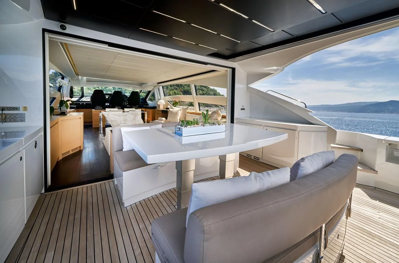 a room with a couch and a table aboard HIT Yacht for Sale