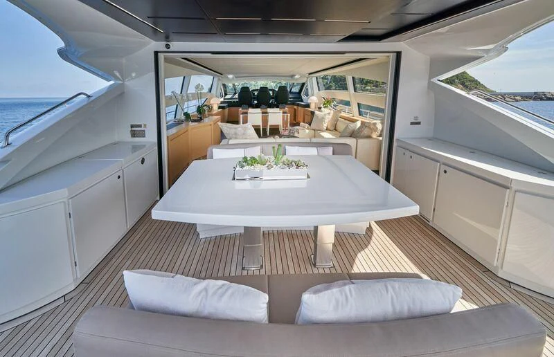 a large white table in a room aboard HIT Yacht for Sale