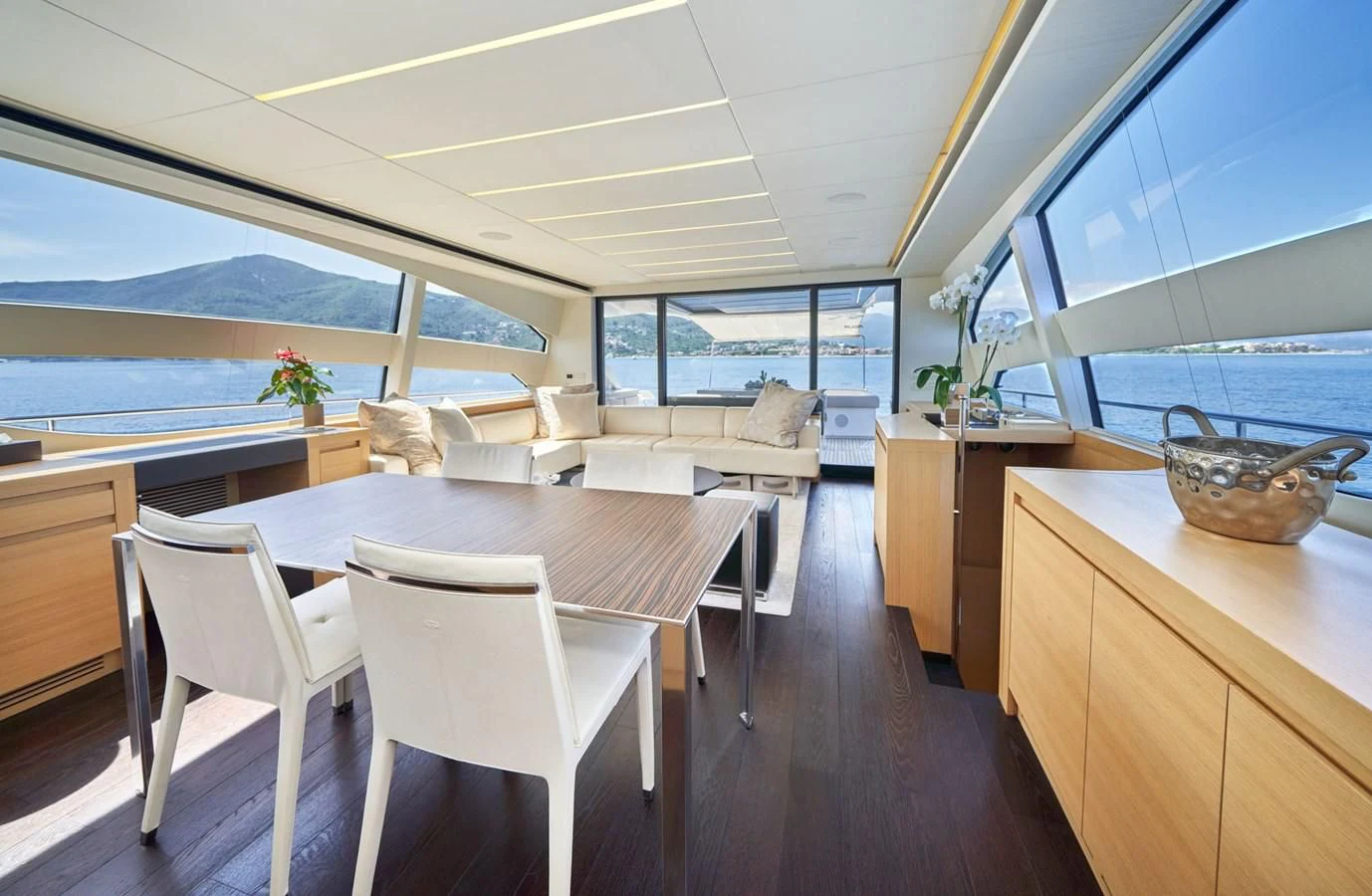 a large kitchen with a large window aboard HIT Yacht for Sale