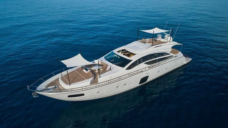 a white yacht in the water aboard HIT Yacht for Sale