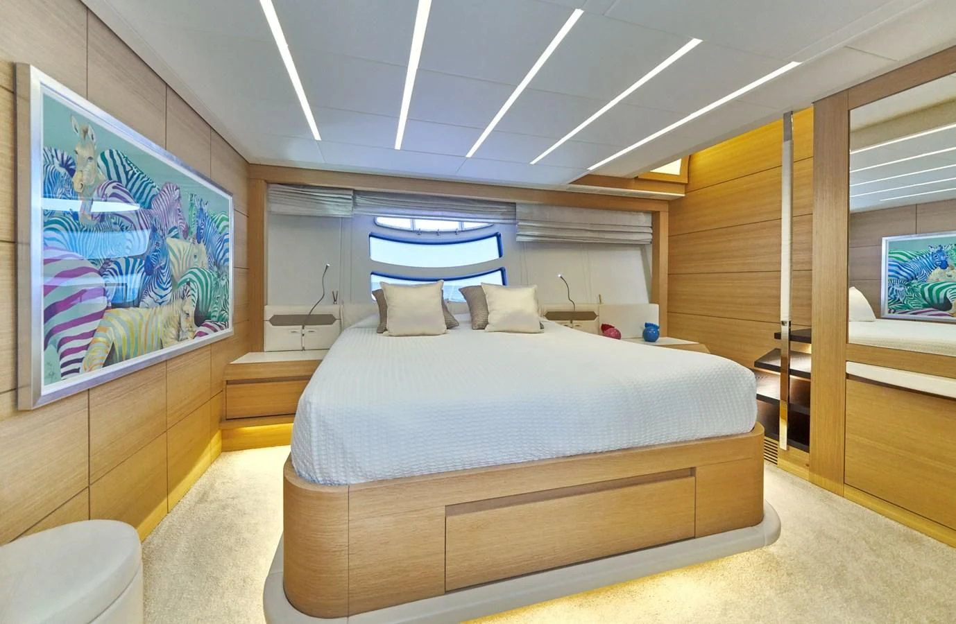 a bedroom with a large bed aboard HIT Yacht for Sale
