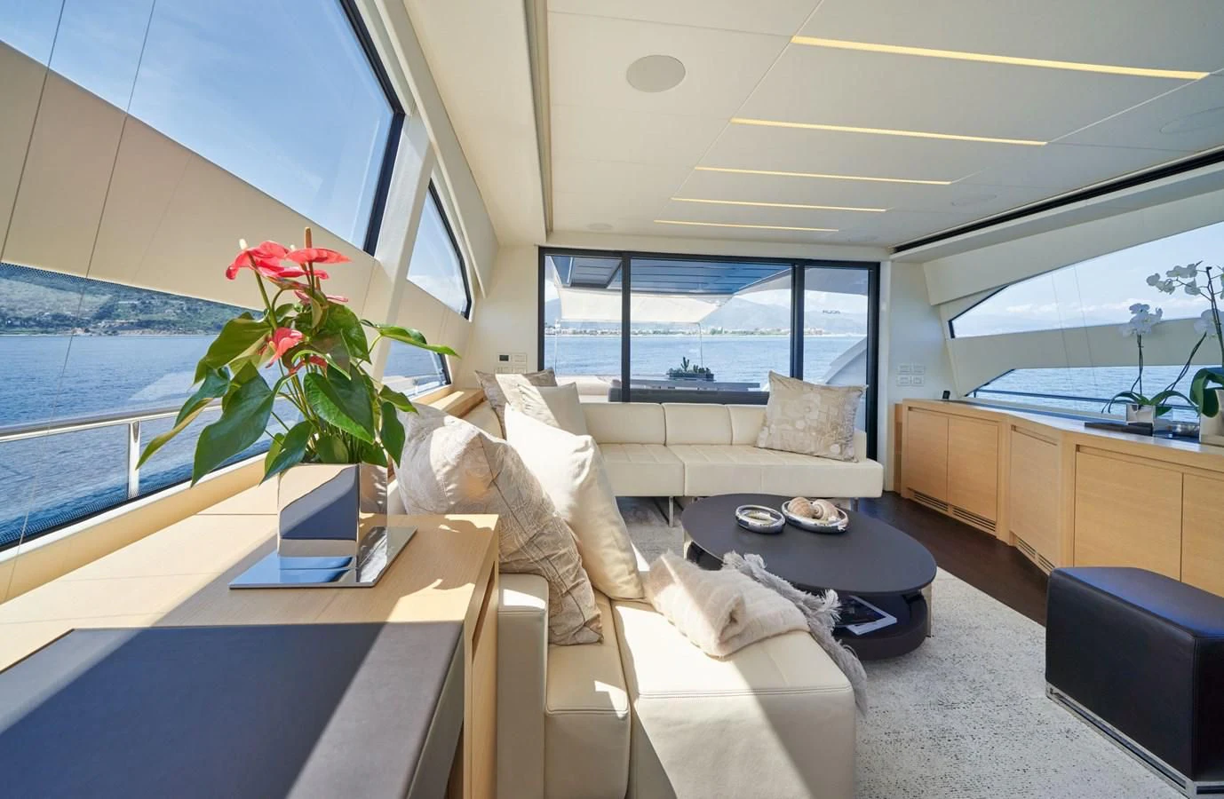 a living room with a large window aboard HIT Yacht for Sale