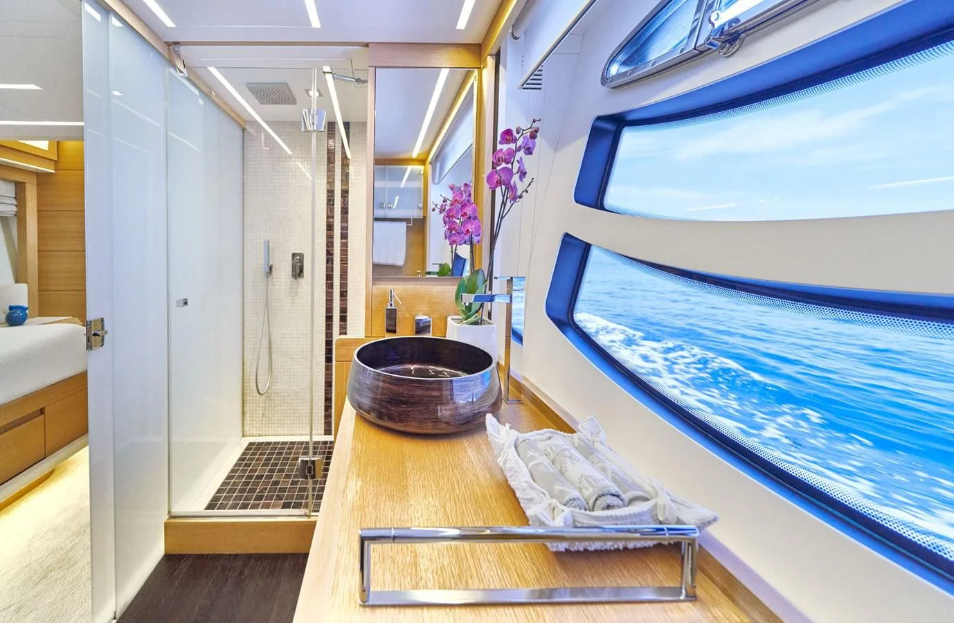 a bathroom with a sink and a mirror aboard HIT Yacht for Sale