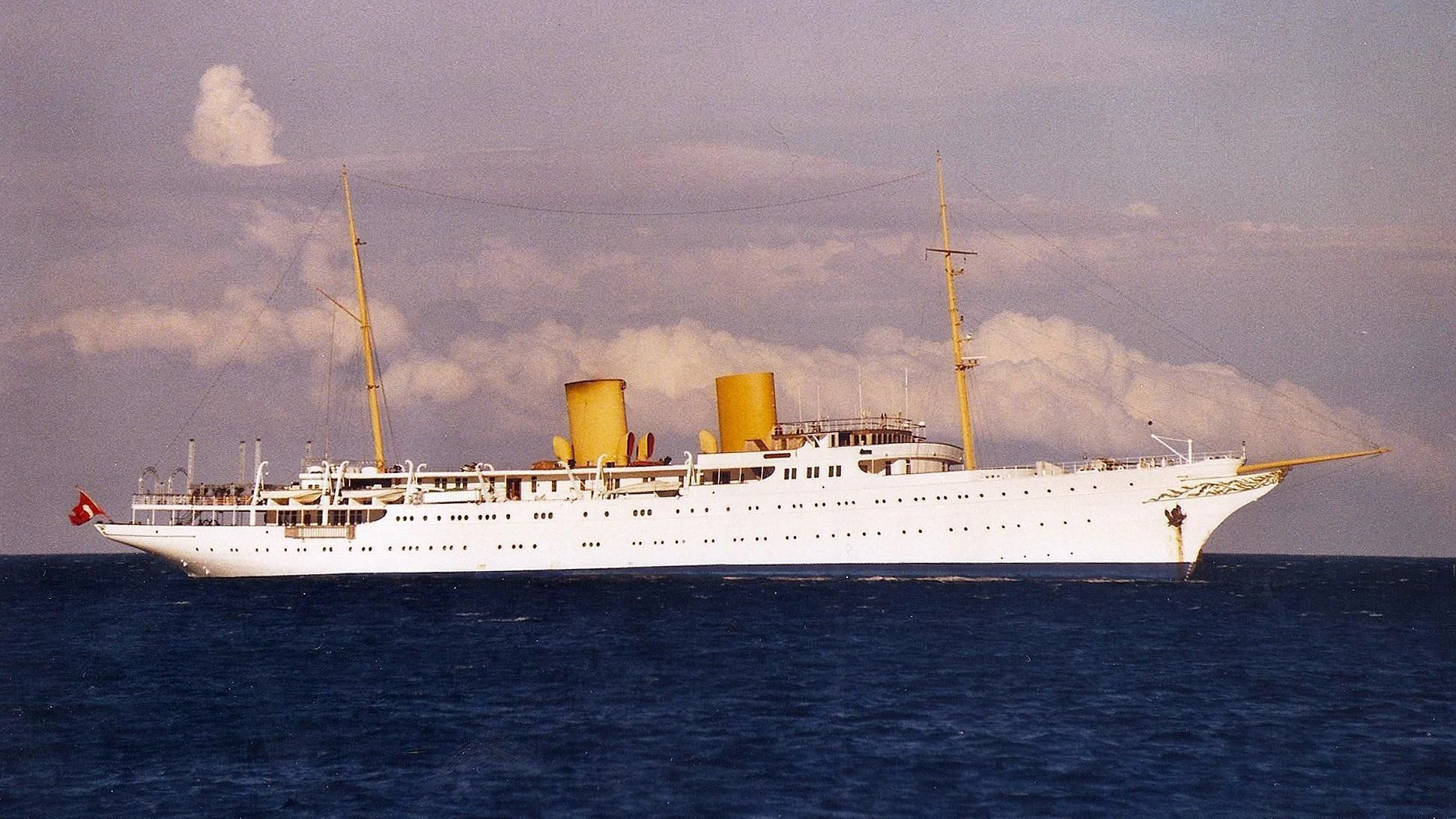 a large white ship in the water aboard SAVARONA Yacht for Sale