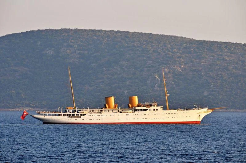 a large white ship in the water aboard SAVARONA Yacht for Sale