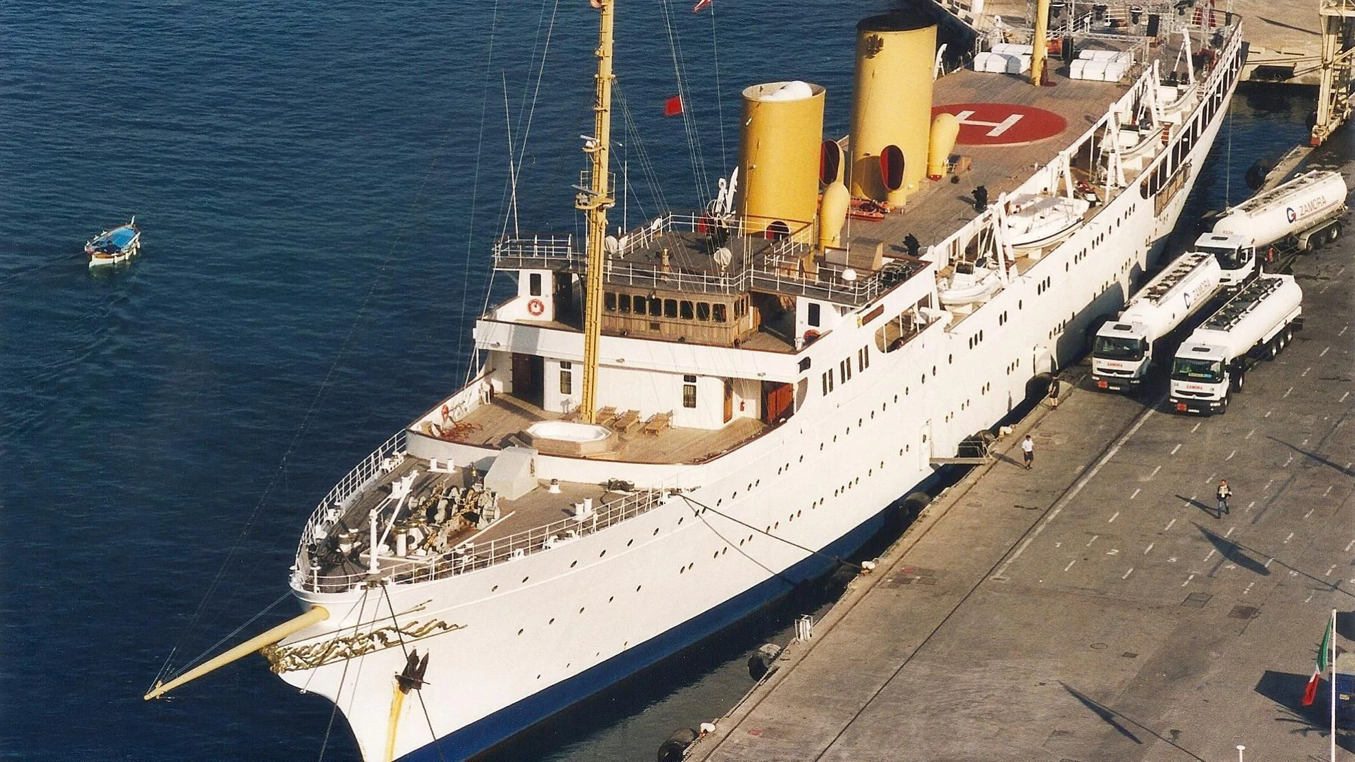 a large ship in the water aboard SAVARONA Yacht for Sale