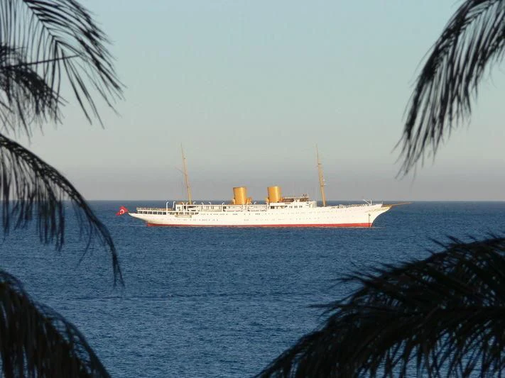 a large ship in the water aboard SAVARONA Yacht for Sale