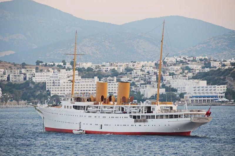 a large ship in the water aboard SAVARONA Yacht for Sale