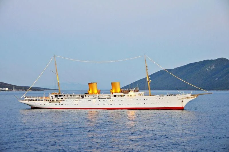 a large white ship in the water aboard SAVARONA Yacht for Sale