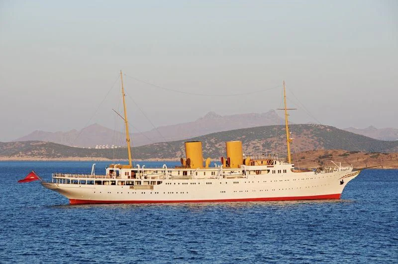 a large white ship in the water aboard SAVARONA Yacht for Sale