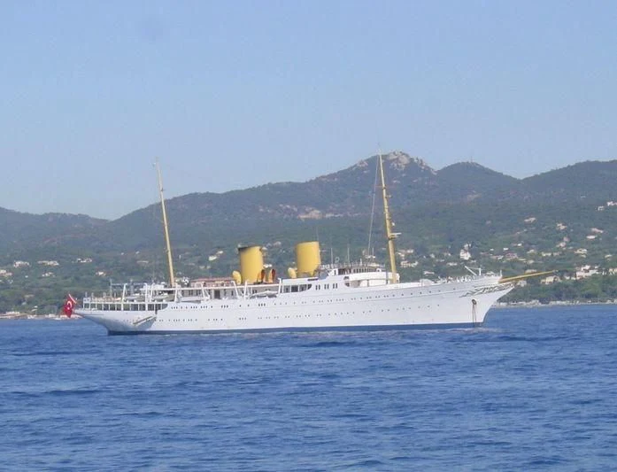 a large white boat in the water aboard SAVARONA Yacht for Sale