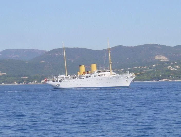a large white boat in the water aboard SAVARONA Yacht for Sale