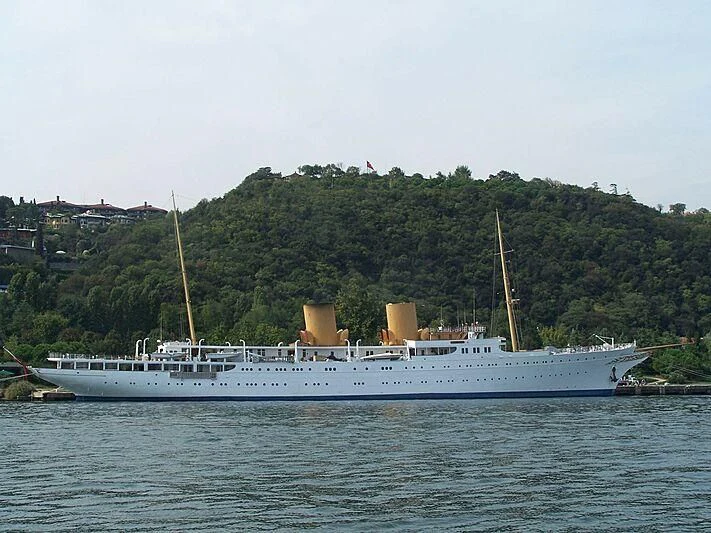 a large white boat in the water aboard SAVARONA Yacht for Sale