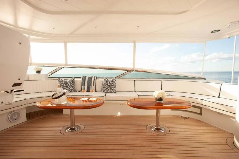 a room with a table and chairs aboard BRAVEHEART Yacht for Sale