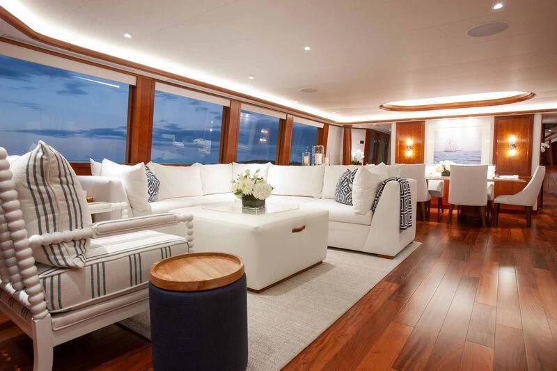 a living room with a couch and a table aboard BRAVEHEART Yacht for Sale