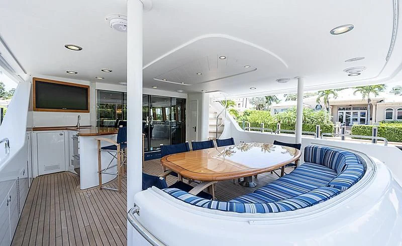 a room with a table and chairs aboard BRAVEHEART Yacht for Sale